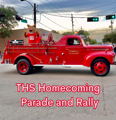 Tomball mascot rides in the original fire truck Howe