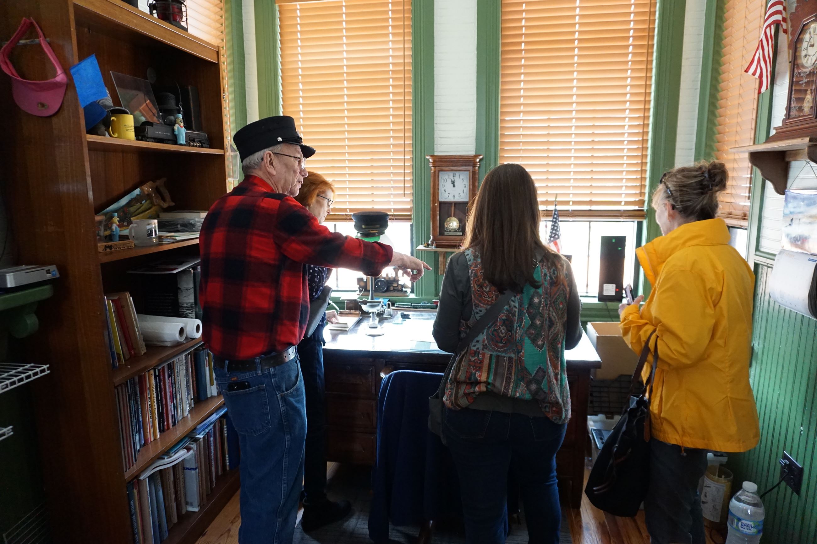Group of ladies enjoy seeing the old telegraph desk at the Depot